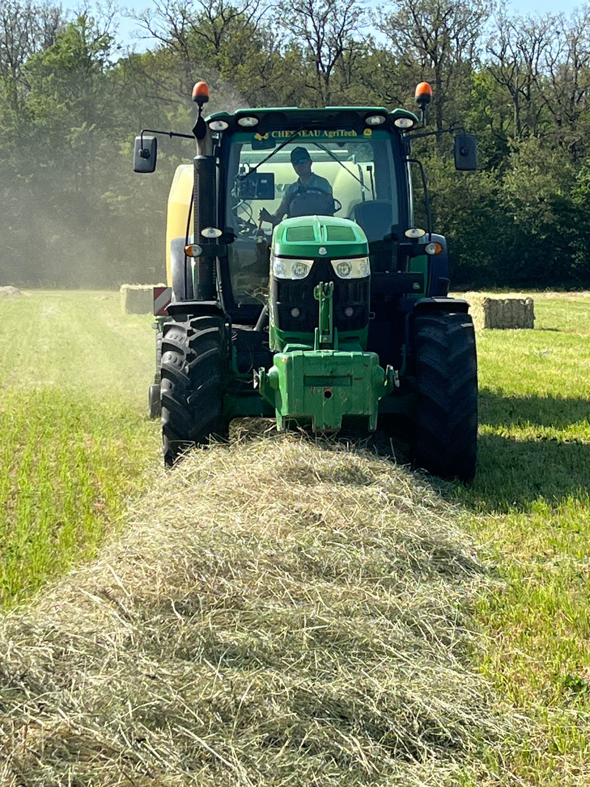 tractor collecting hay.jpeg
